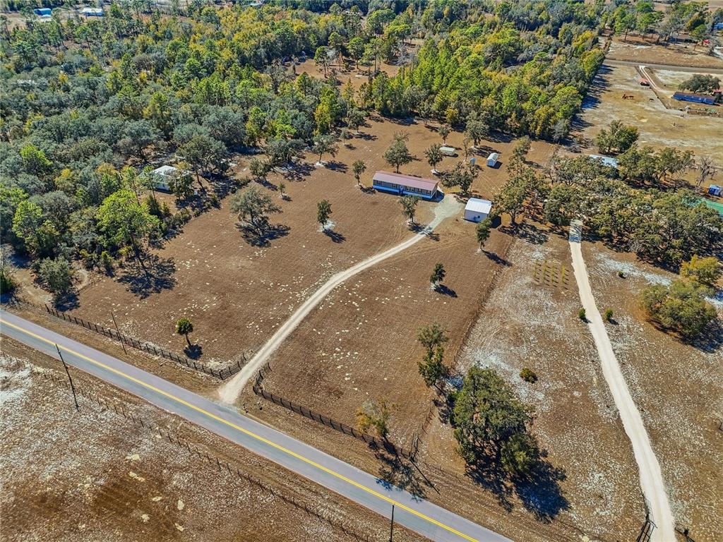 5530 Northeast 103rd Terrace Bronson, FL 32621 - Photo 28 of 29 an aerial view of a house with a yard