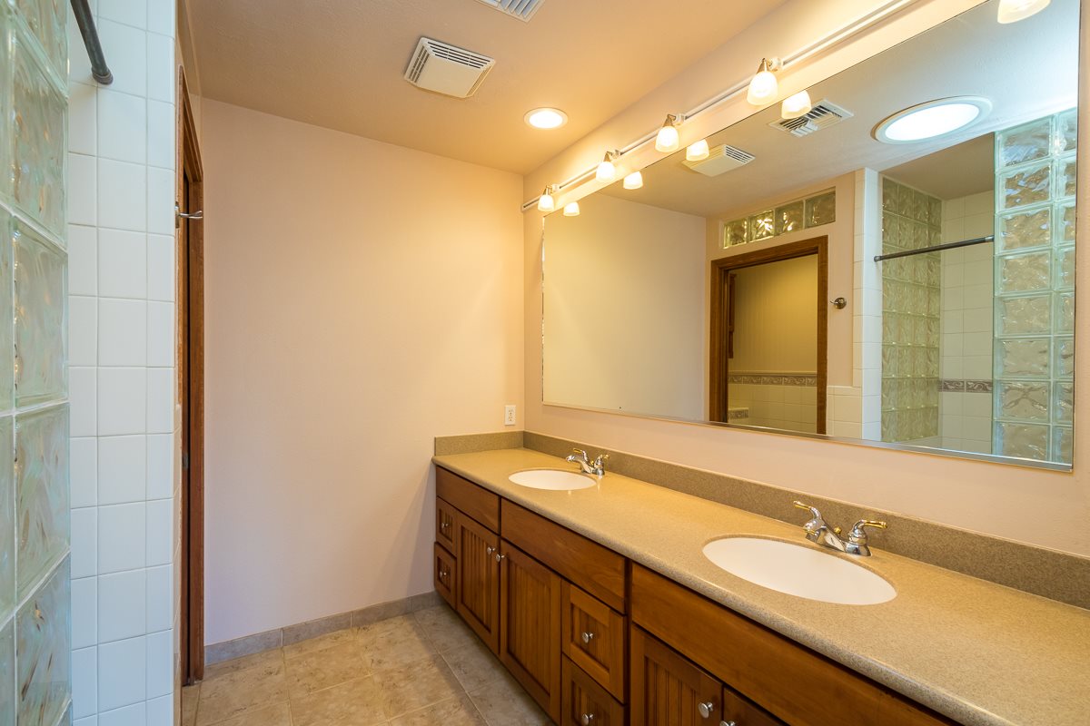 395 Middle Road Kula, HI 96790 - Photo 12 of 30 a bathroom with a sink double vanity and a mirror