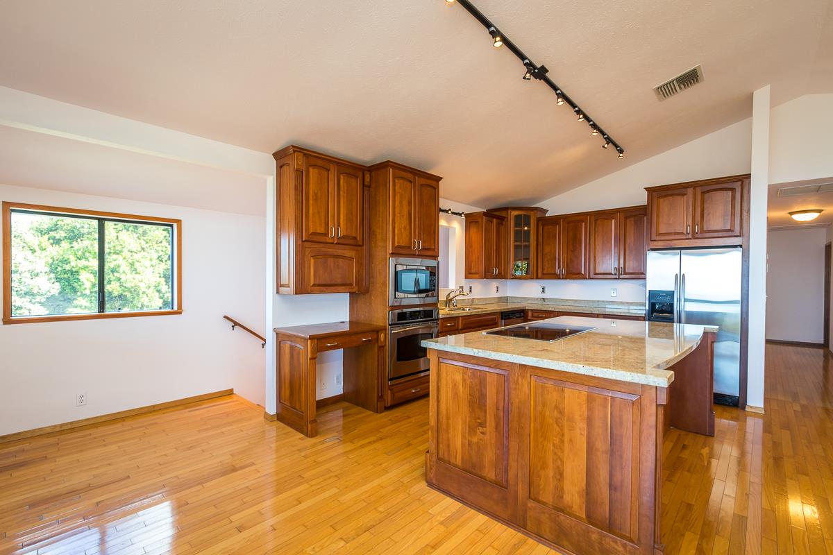 395 Middle Road Kula, HI 96790 - Photo 17 of 30 a kitchen that has a sink and a stove in it