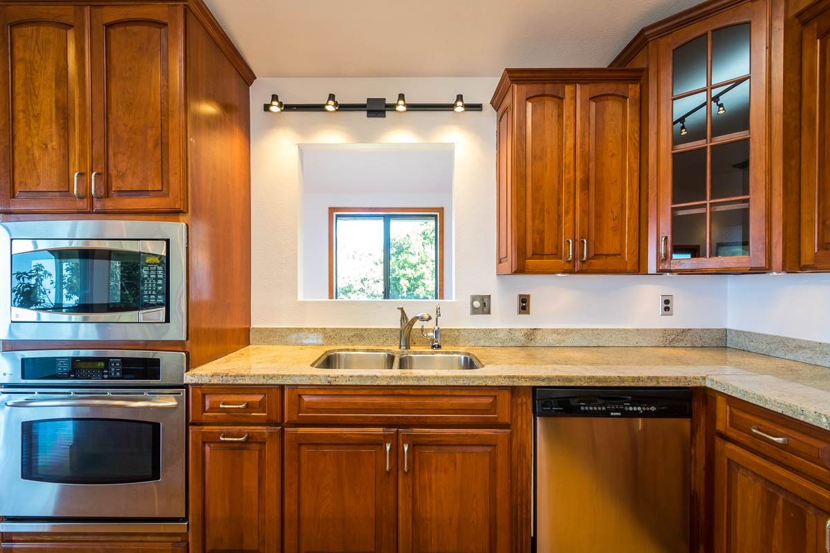 395 Middle Road Kula, HI 96790 - Photo 20 of 30 a kitchen with stainless steel appliances a sink stove and cabinets