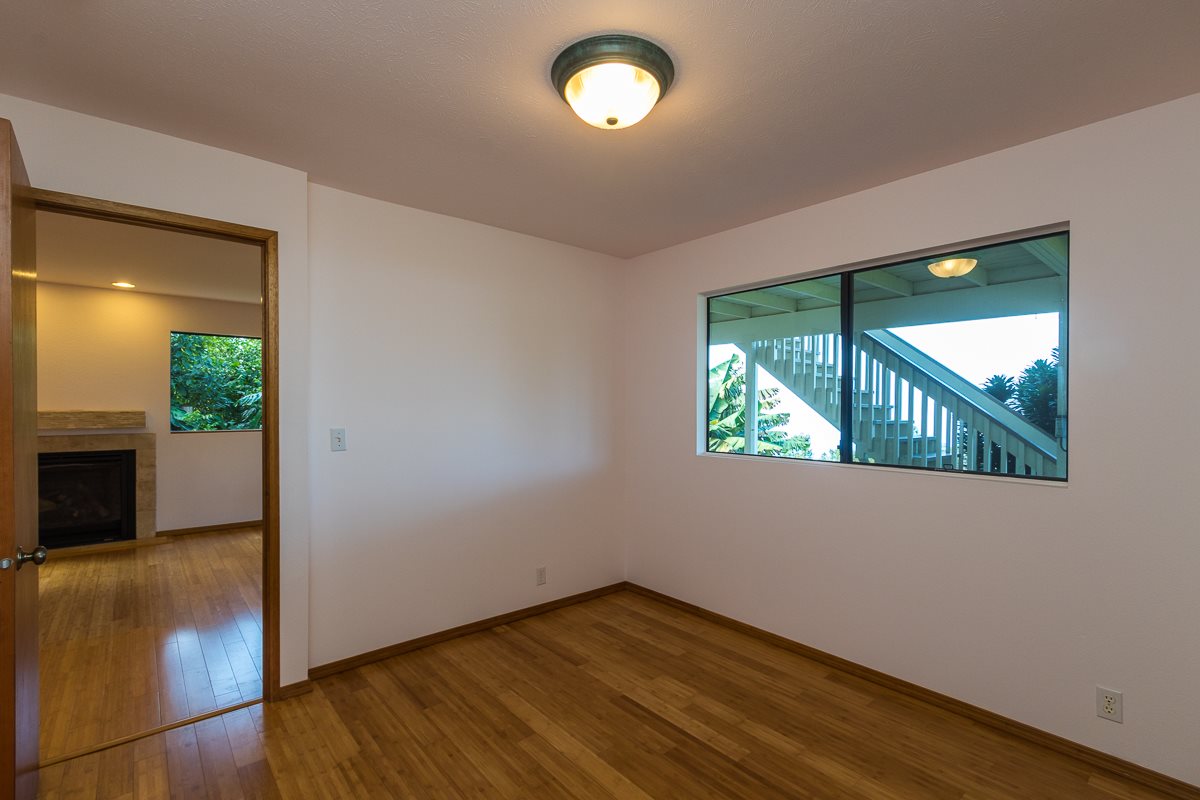 395 Middle Road Kula, HI 96790 - Photo 23 of 30 an empty room with wooden floor and windows