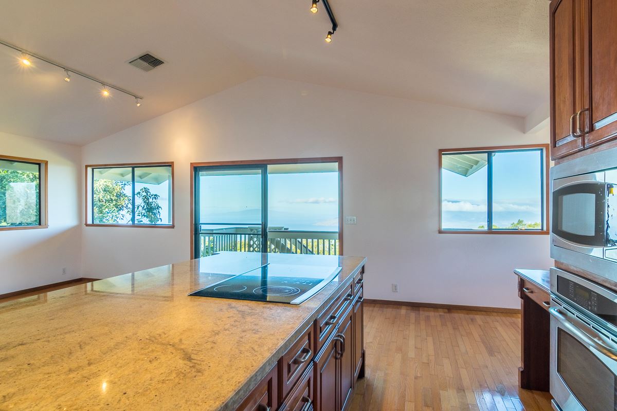 395 Middle Road Kula, HI 96790 - Photo 27 of 30 a bedroom with furniture and a window