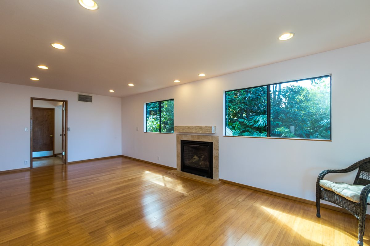 395 Middle Road Kula, HI 96790 - Photo 5 of 30 wooden floor in an empty room with a window