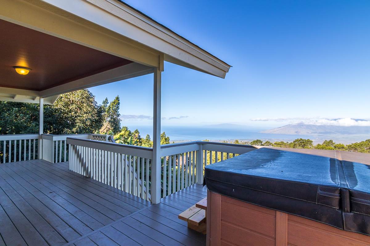 395 Middle Road Kula, HI 96790 - Photo 6 of 30 a view of a deck with wooden floor and outdoor seating