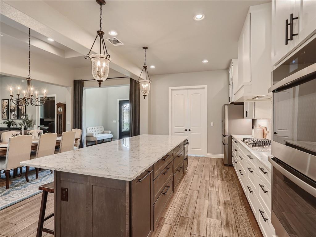 132 Huerta Road Florence, TX 76527 - Photo 9 of 40 Culinary delights await in this bright kitchen with a spacious island and modern appliances.