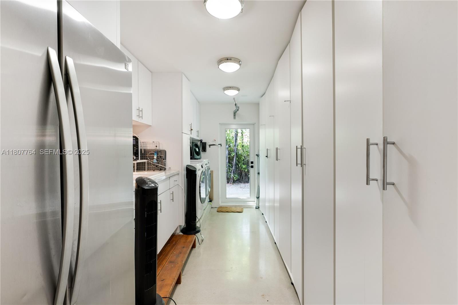270 Island Drive Key Biscayne, FL 33149 - Photo 14 of 19 a kitchen with stainless steel appliances a refrigerator and a sink