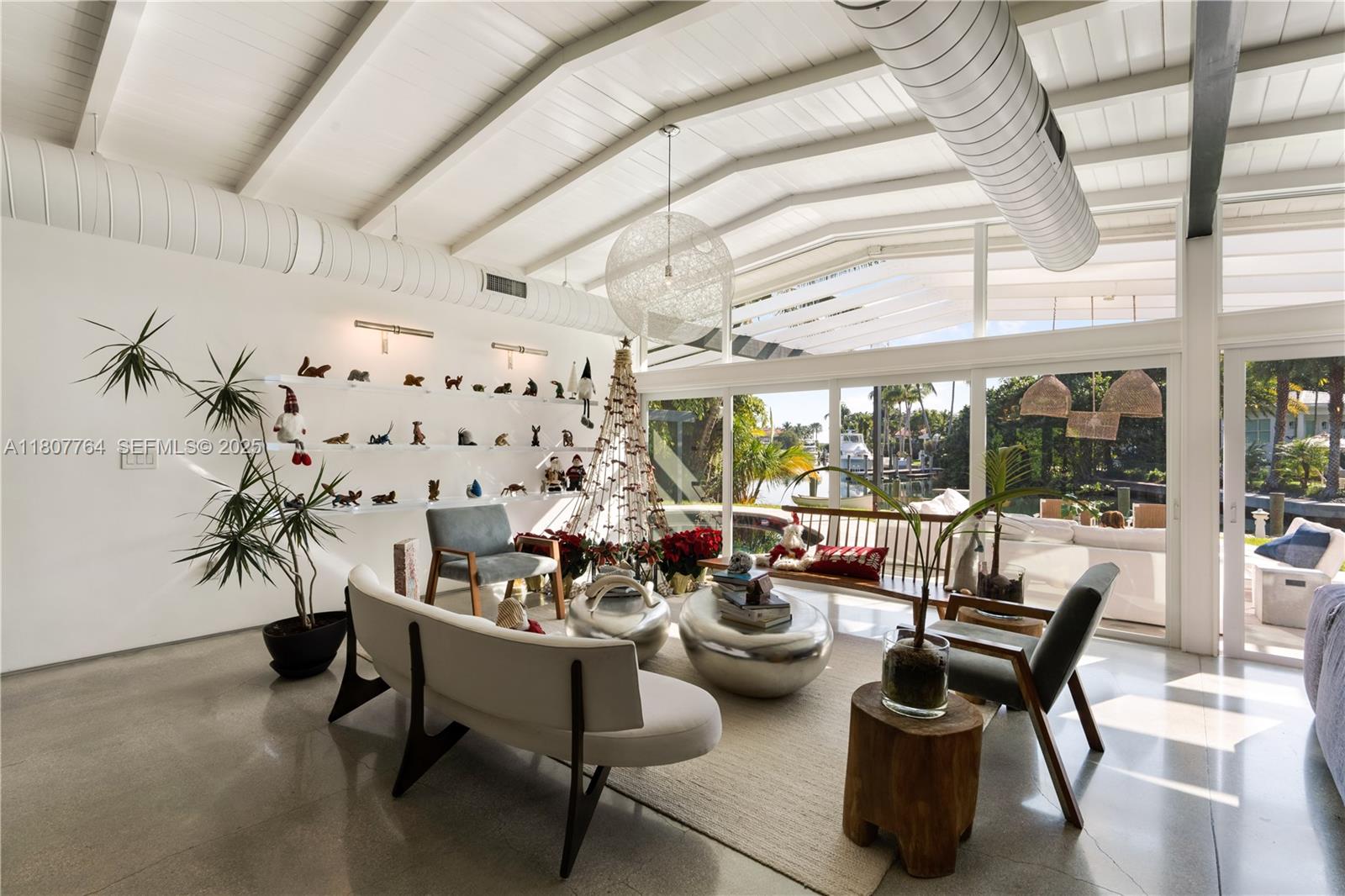 270 Island Drive Key Biscayne, FL 33149 - Photo 7 of 19 a living room with furniture and a large window