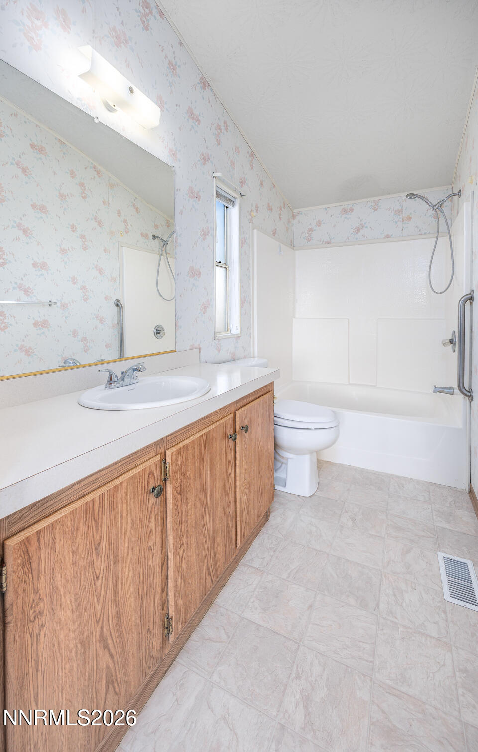 6312 Sierra Way Fallon, NV 89406 - Photo 14 of 20 a spacious bathroom with a granite countertop sink a toilet and a bathtub