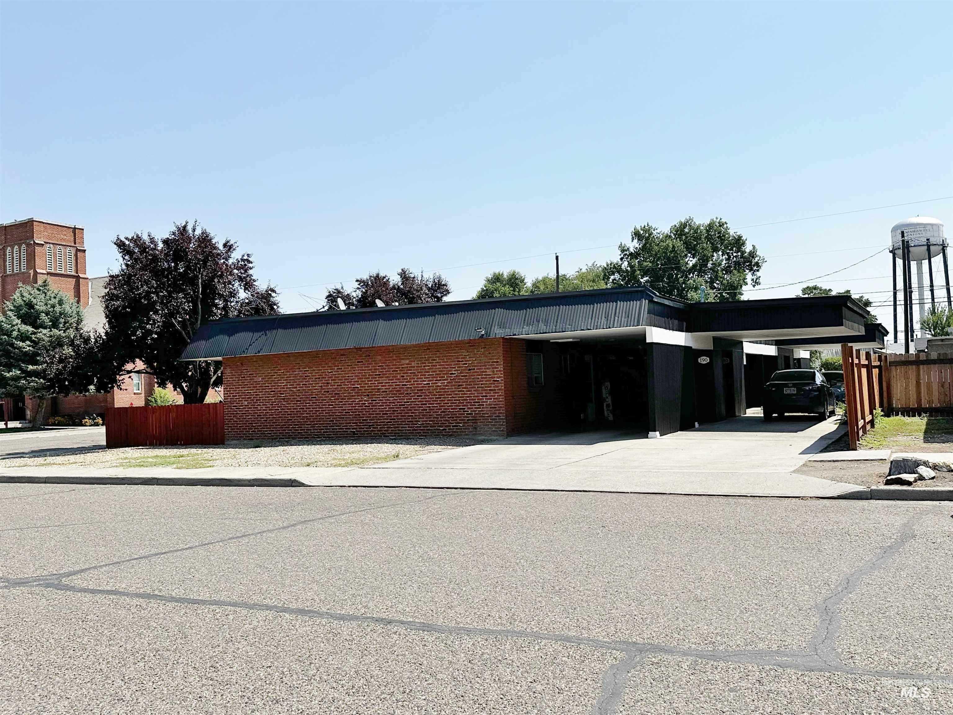 160 Northwest 3rd Street Ontario, OR 97914 - Photo 1 of 4 View of property featuring an attached carport and concrete driveway