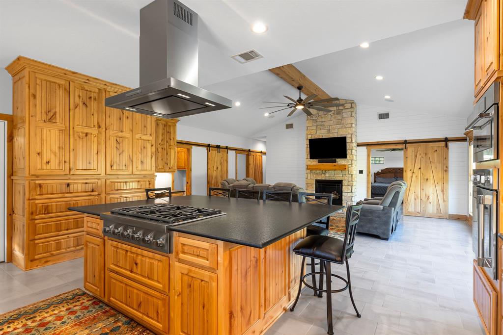 2072 East US 69 Emory, TX 75440 - Photo 14 of 39 a kitchen with stainless steel appliances granite countertop a stove and a refrigerator