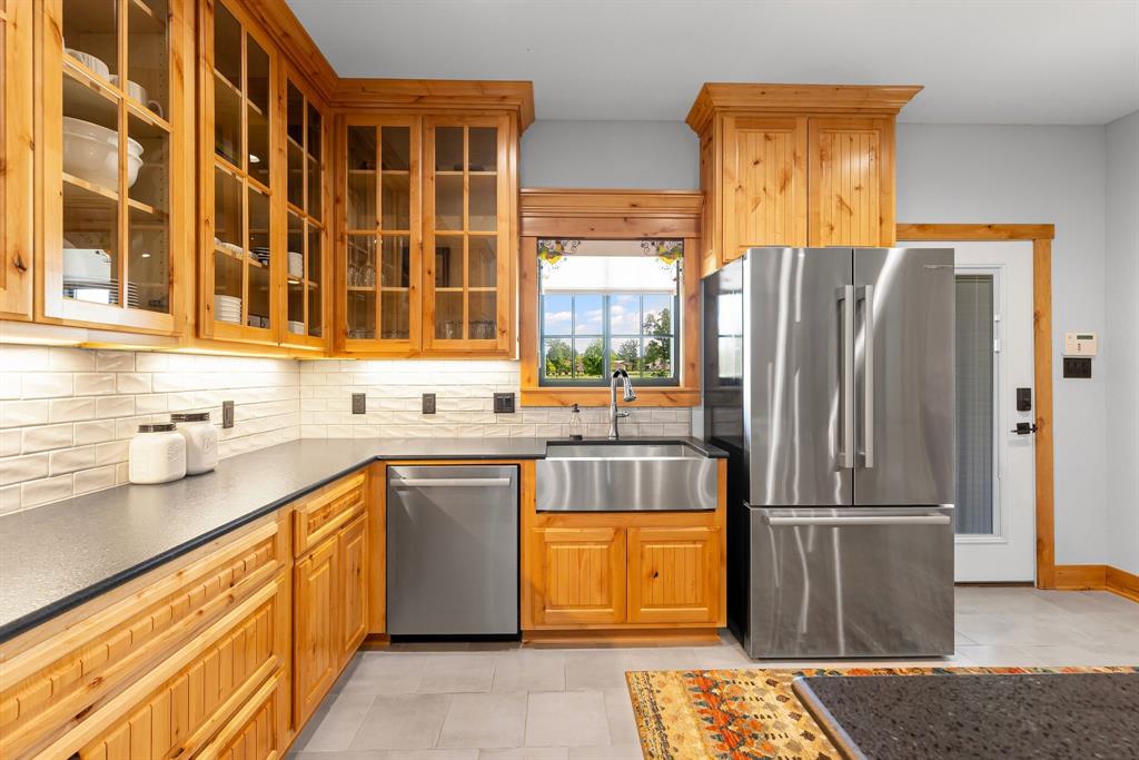 2072 East US 69 Emory, TX 75440 - Photo 15 of 39 a kitchen with stainless steel appliances granite countertop a refrigerator and a sink