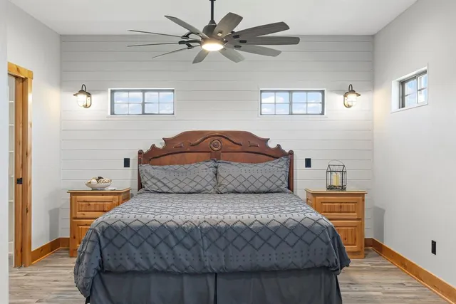 a bedroom with a bed and a chandelier