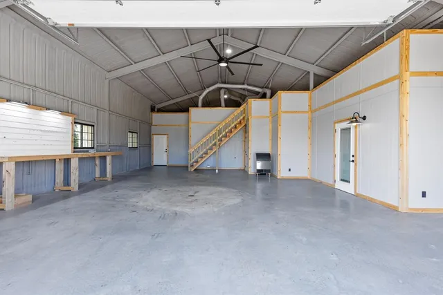 a view of an empty room with a fireplace
