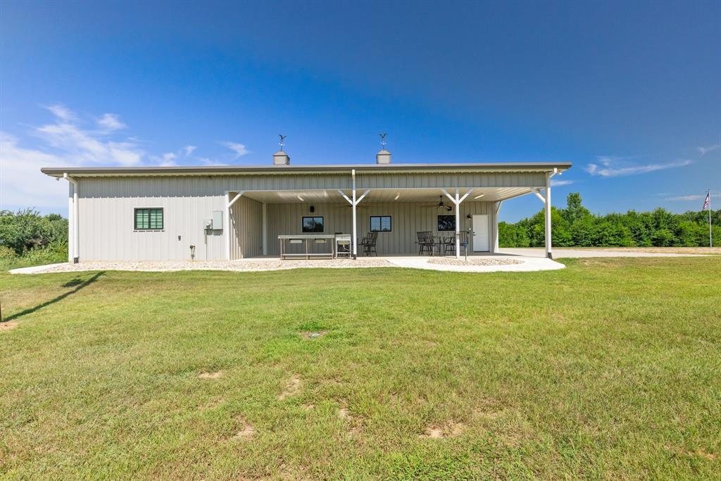 2072 East US 69 Emory, TX 75440 - Photo 5 of 39 a view of a house with outdoor space and sitting area