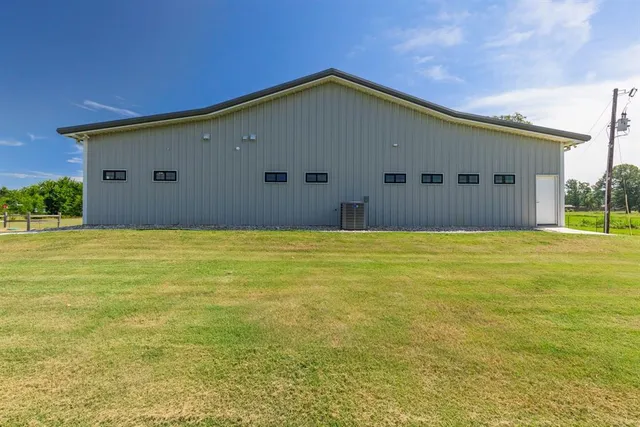 a big house with swimming pool in front of it