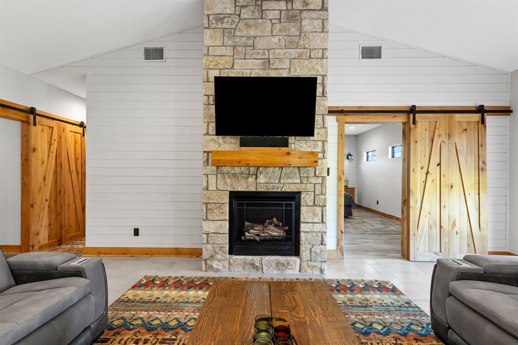 2072 East US 69 Emory, TX 75440 - Photo 9 of 39 a living room with furniture and a fireplace