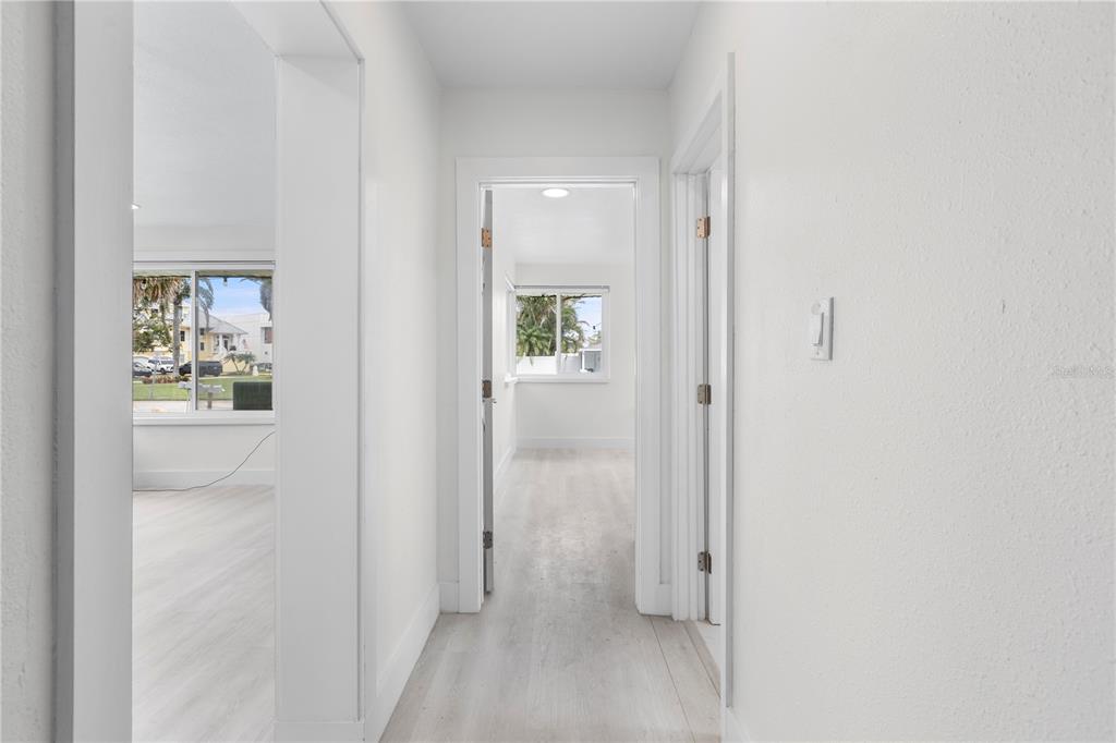 14060 Miramar Avenue, Unit 1 #2 #3 #4 Madeira Beach, FL 33708 - Photo 13 of 38 a view of a hallway with white walls and closet