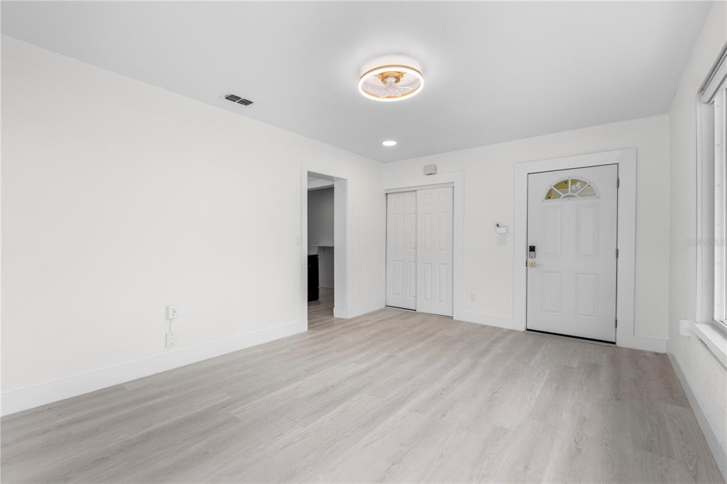 14060 Miramar Avenue, Unit 1 #2 #3 #4 Madeira Beach, FL 33708 - Photo 19 of 38 a view of an empty room with wooden floor