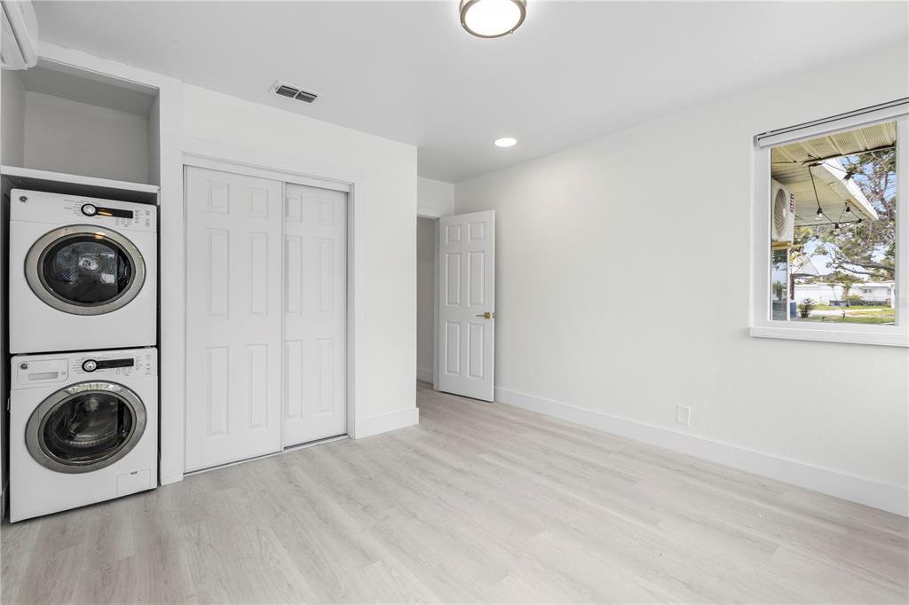 14060 Miramar Avenue, Unit 1 #2 #3 #4 Madeira Beach, FL 33708 - Photo 21 of 38 a view of a hallway with washer and dryer