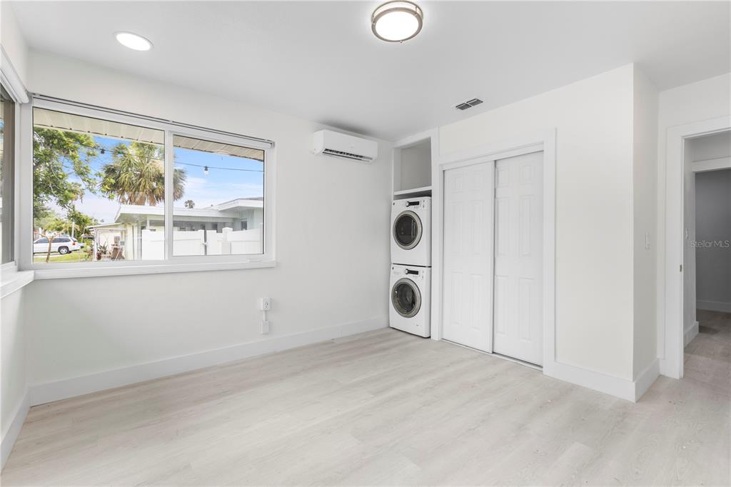 14060 Miramar Avenue, Unit 1 #2 #3 #4 Madeira Beach, FL 33708 - Photo 22 of 38 a view of a livingroom with a large window