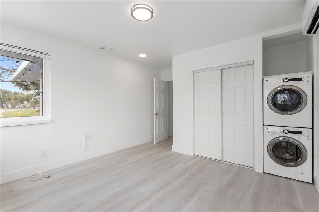 14060 Miramar Avenue, Unit 1 #2 #3 #4 Madeira Beach, FL 33708 - Photo 26 of 38 a view of a storage and utility room with a washer and dryer