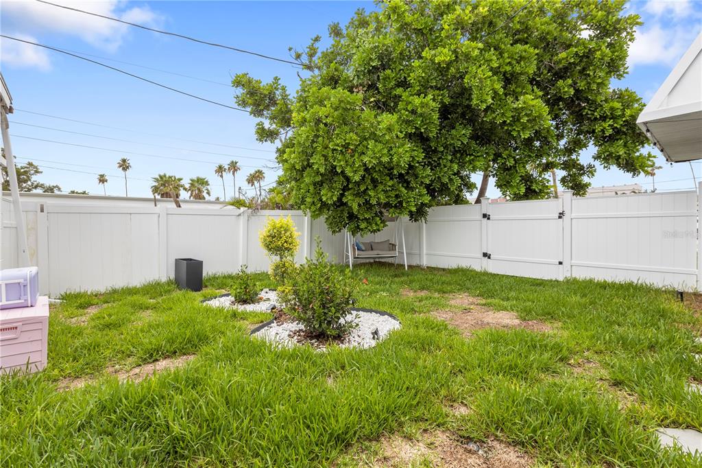 14060 Miramar Avenue, Unit 1 #2 #3 #4 Madeira Beach, FL 33708 - Photo 32 of 38 a view of a back yard