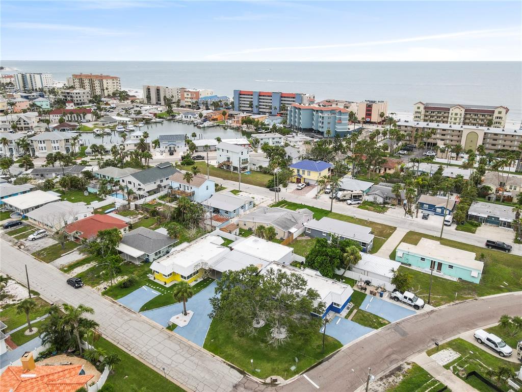 14060 Miramar Avenue, Unit 1 #2 #3 #4 Madeira Beach, FL 33708 - Photo 34 of 38 an aerial view of multiple house