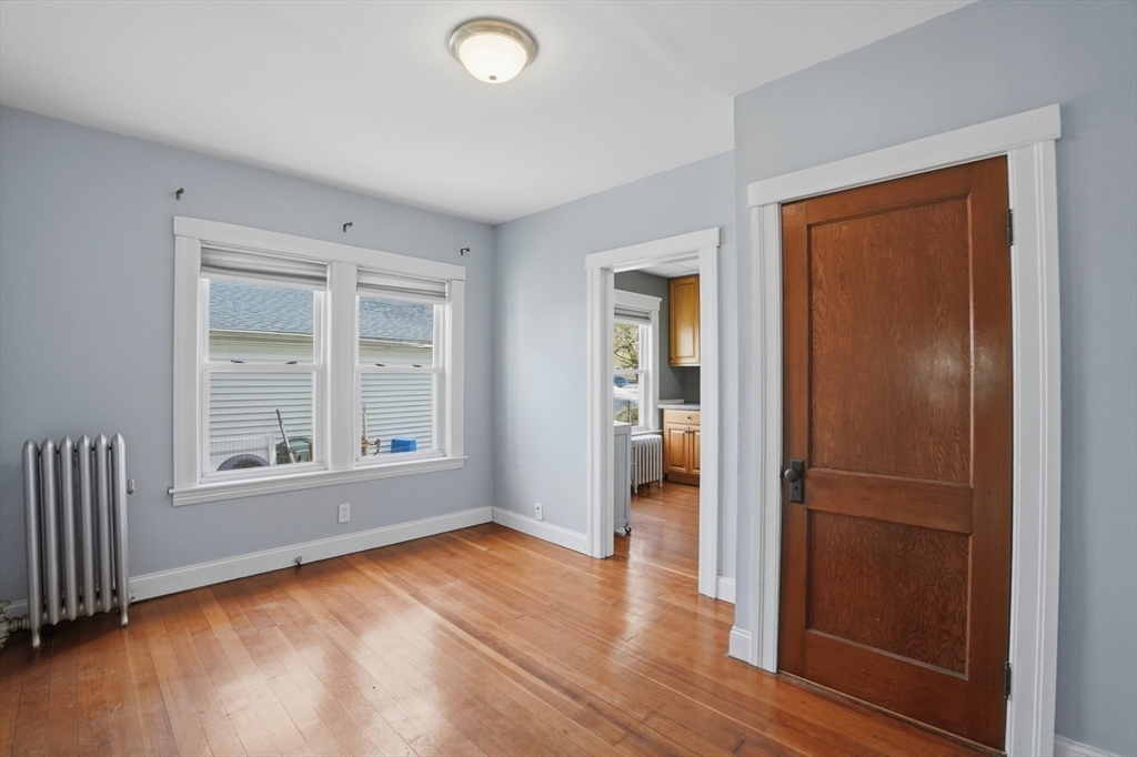 3 Boyden St Extension Webster, MA 01570 - Photo 13 of 34 an empty room with wooden floor closet and windows