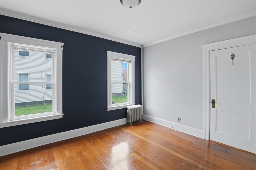 3 Boyden St Extension Webster, MA 01570 - Photo 20 of 34 a view of an empty room with wooden floor and a window