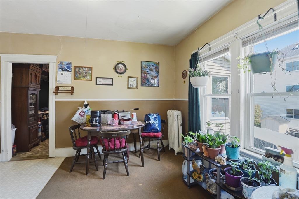 3 Boyden St Extension Webster, MA 01570 - Photo 26 of 34 a living room with furniture and flowers
