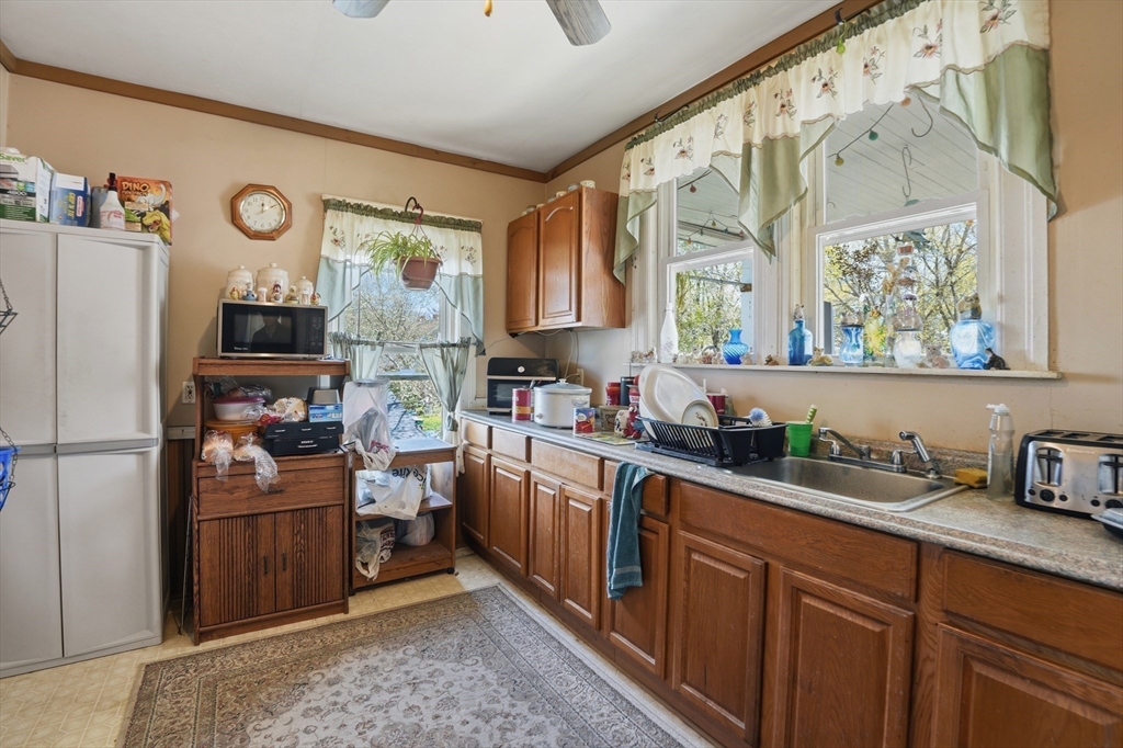 3 Boyden St Extension Webster, MA 01570 - Photo 27 of 34 a kitchen with a refrigerator and a sink