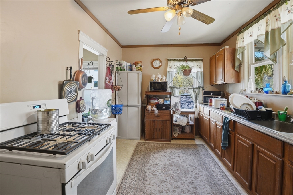 3 Boyden St Extension Webster, MA 01570 - Photo 28 of 34 a kitchen with a stove and a refrigerator