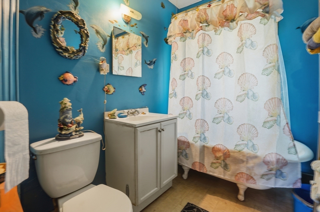 3 Boyden St Extension Webster, MA 01570 - Photo 29 of 34 a bathroom with a sink mirror vanity and toilet
