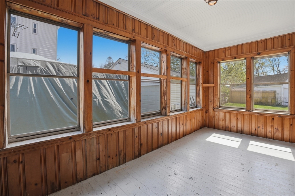 3 Boyden St Extension Webster, MA 01570 - Photo 4 of 34 a view of a porch with wooden floor and furniture