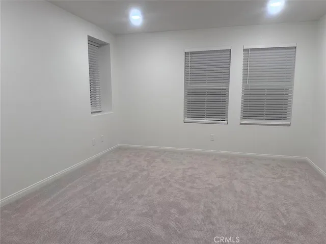 a bathroom with a shower sink vanity and mirror