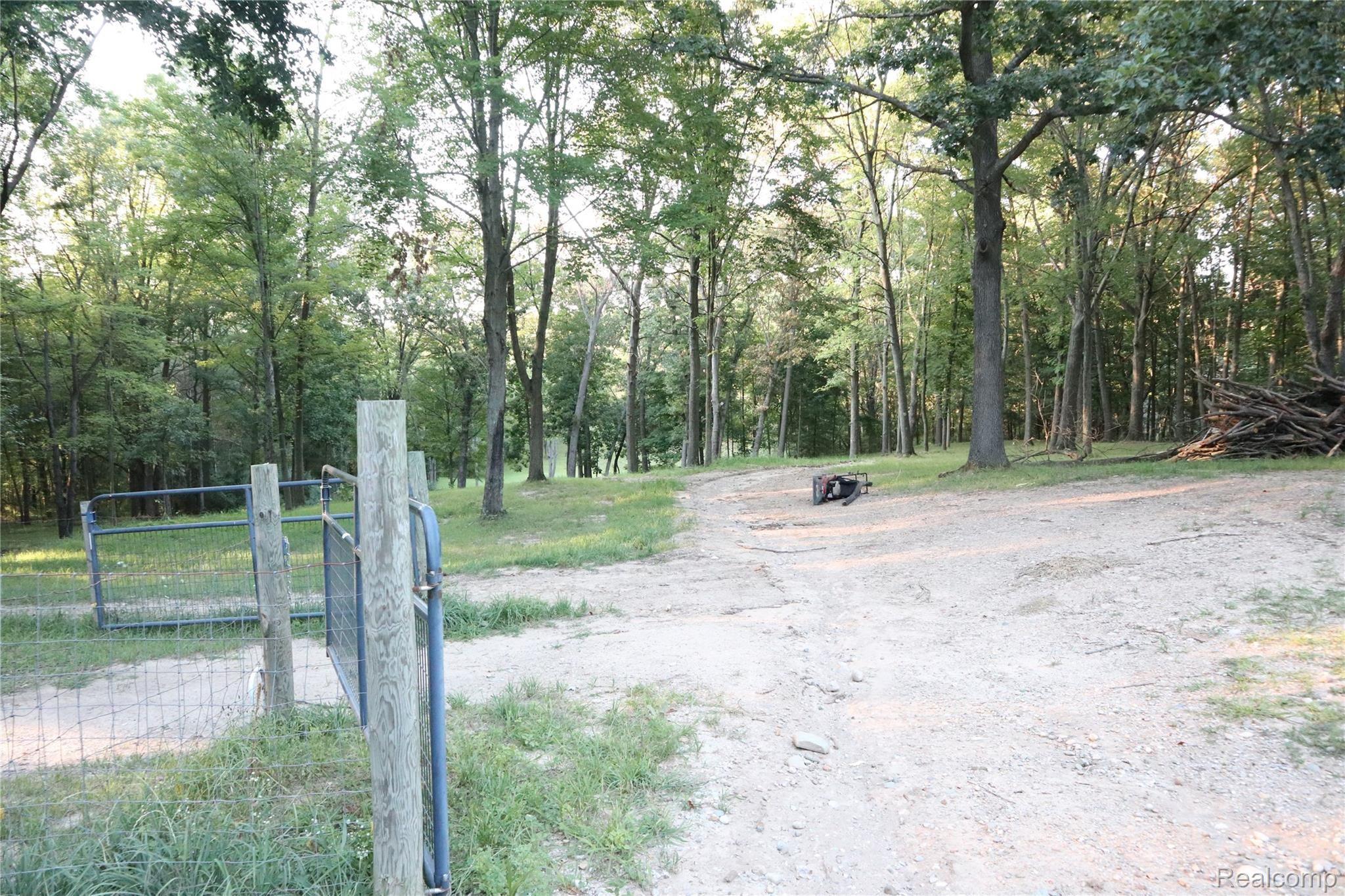 2947 East Schafer Road Howell, MI 48843 - Photo 19 of 48 GATE LEADING TO MEADOW