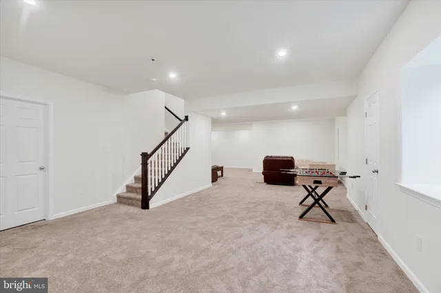 a view of a room with gym equipment and windows