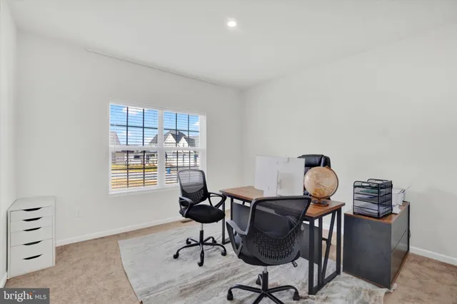 a workspace with furniture and a window