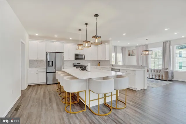 a view of kitchen with cabinets and wooden floor