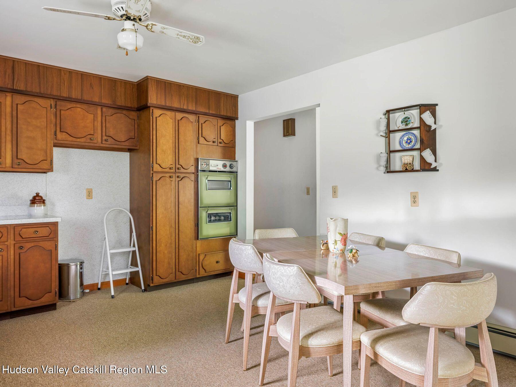 104 New Paltz Road Highland, NY 12528 - Photo 3 of 43 a dining room with furniture and a chandelier
