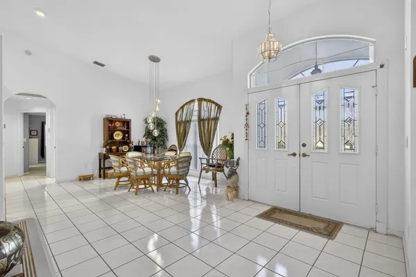 a view of a livingroom with furniture and a chandelier