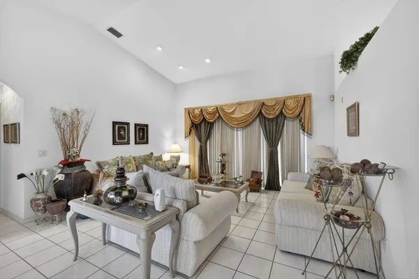 a view of a livingroom with furniture and natural light