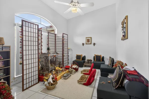 a kitchen with a sink a refrigerator and cabinets