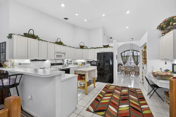 a bedroom with a bed window and walk in closet