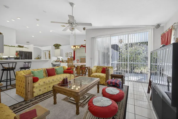a bedroom with two bed and a chandelier