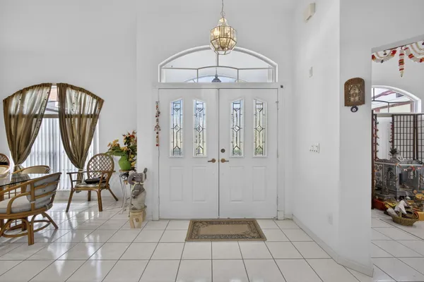 a view of a livingroom with furniture and a entryway