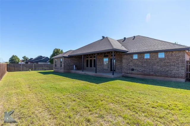 a house with swimming pool in front of it