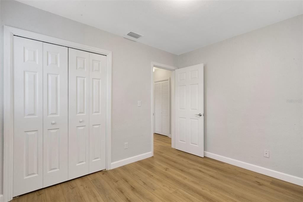 2716 Hardin Combee Road Lakeland, FL 33801 - Photo 16 of 32 a view of an empty room with wooden floor