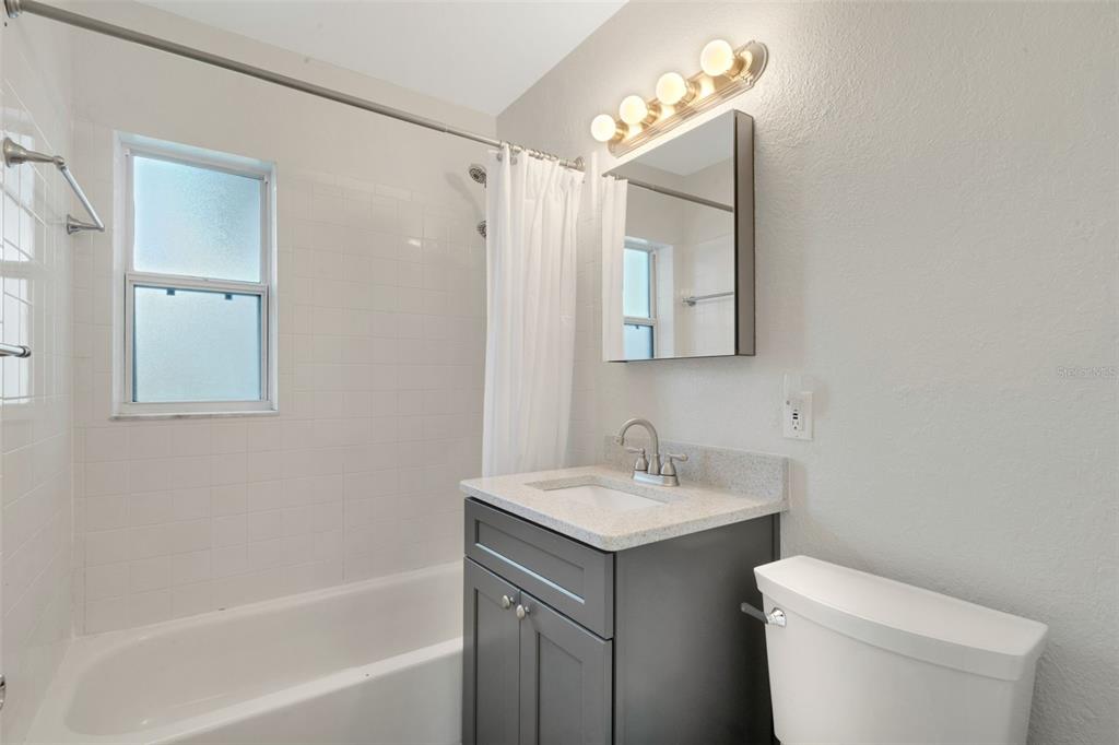 2716 Hardin Combee Road Lakeland, FL 33801 - Photo 18 of 32 a bathroom with a sink toilet and shower