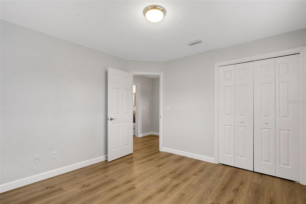 2716 Hardin Combee Road Lakeland, FL 33801 - Photo 20 of 32 a view of an empty room with wooden floor